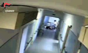 Un fermo immagine tratto da un video dei carabinieri mostra un momento dell'operazione che ha portato alla sospensione di 14 operatori dell'Aias di Decimomannu, Cagliari, accusati di aver maltrattato alcuni spastici ospitati nella struttura.