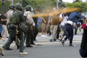 Police pepper sprayed protesters as they moved them down Har