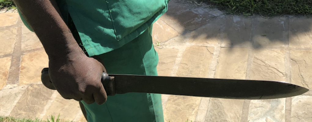 African man holding a machete