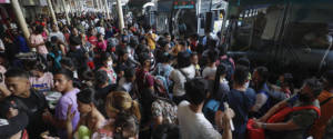 epa08291745 Travellers flock to the Araneta bus depot in hopes to get a bus ride out of the capital region before a community quarantine takes effect, in Quezon City, Metro Manila, Philippines, 13 March 2020. Philippine President Rodrigo Duterte announced a community quarantine on Metro Manila effective 15 March to 14 April 2020, after the Philippines raised Code Red Sub-Level 2 on the Covid-19 coronavirus outbreak. The Philippines has over 50 confirmed cases with five deaths after the World Health Organization (WHO) officially declared the coronavirus outbreak a pandemic.  EPA/ROLEX DELA PENA