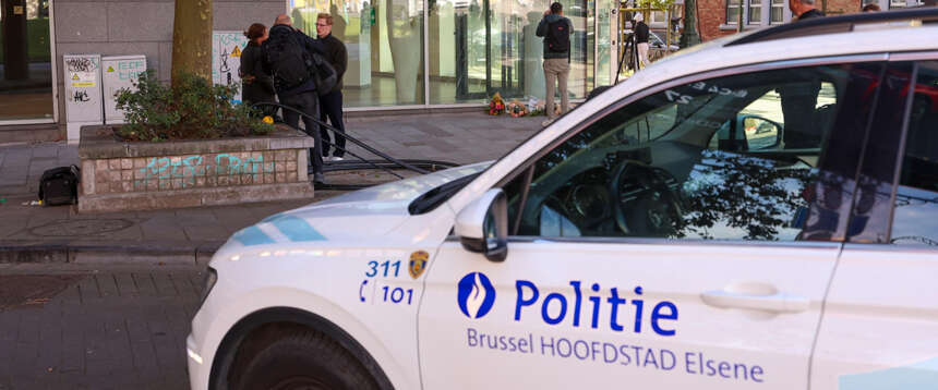 epa10923485 Police at the bank branch, where two football supporters from Sweden were shot dead in a terror attack in Brussels, Belgium, 17 October 2023. A man, suspected of killing two Swedish football supporters on 16 October, was shot by the Police during an operation and has died, Belgian Police said. Following the incident, the Brussels Capital Region has increased its terror threat to level 4, the highest, the National Crisis Center announced. EPA/OLIVIER HOSLET epa10923485 Police at the bank branch, where two football supporters from Sweden were shot dead in a terror attack in Brussels, Belgium, 17 October 2023. A man, suspected of killing two Swedish football supporters on 16 October, was shot by the Police during an operation and has died, Belgian Police said. Following the incident, the Brussels Capital Region has increased its terror threat to level 4, the highest, the National Crisis Center announced. EPA/OLIVIER HOSLET