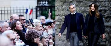 L’ingresso in carcere di Sarkozy diventa show: mano nella mano con Carla, i sostenitori cantano la Marsigliese (video)