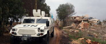 epa12578783 An armoured vehicle of the United Nations Interim Force in Lebanon (UNIFIL) drives next to a destroyed house in the village of Blida, near the border with northern Israel, southern Lebanon, 08 December 2025. The UN Security Council in August voted unanimously to extend for a final time the mandate of UNIFIL until 31 December 2026, after which will start an orderly and safe drawdown and withdrawal within one year.  EPA/WAEL HAMZEH
