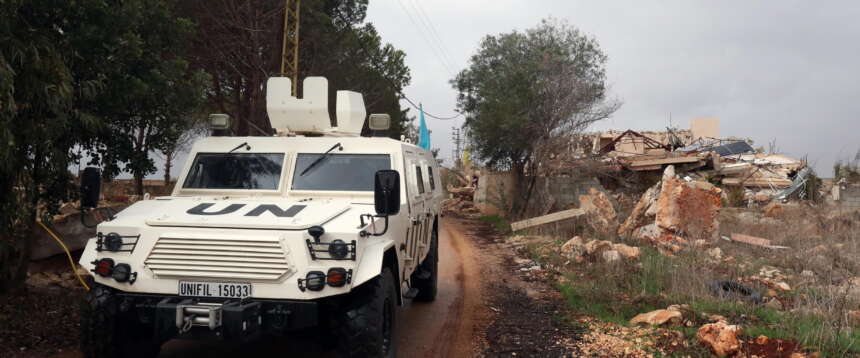epa12578783 An armoured vehicle of the United Nations Interim Force in Lebanon (UNIFIL) drives next to a destroyed house in the village of Blida, near the border with northern Israel, southern Lebanon, 08 December 2025. The UN Security Council in August voted unanimously to extend for a final time the mandate of UNIFIL until 31 December 2026, after which will start an orderly and safe drawdown and withdrawal within one year.  EPA/WAEL HAMZEH